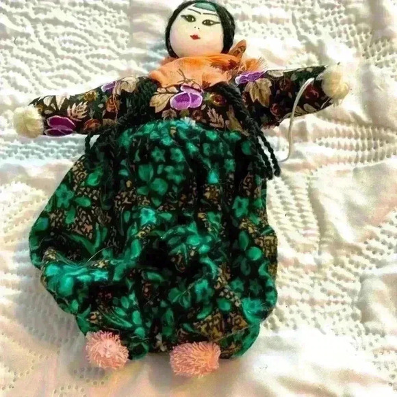 The doll is dressed as an Asian woman.1980s - Picture 1 of 3